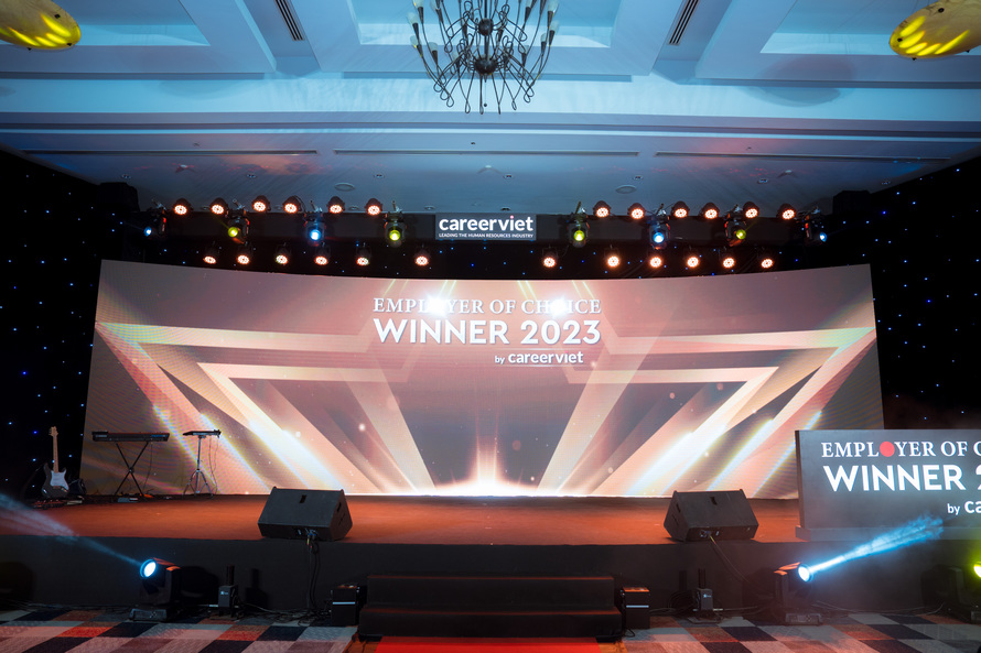 Ảnh sân khấu cùng backdrop ghi Employer of Choice Winer 2023 by CareerViet